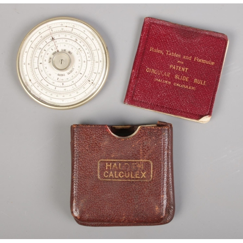 376 - A leather cased Halden Calculex circular slide rule, complete with original booklet.