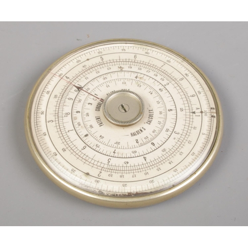 376 - A leather cased Halden Calculex circular slide rule, complete with original booklet.