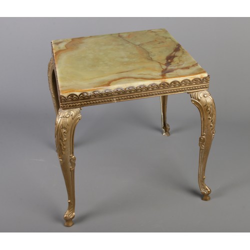 272 - A ornate onyx gilt side table. (H: 35cm, W: 30cm D 33cm)