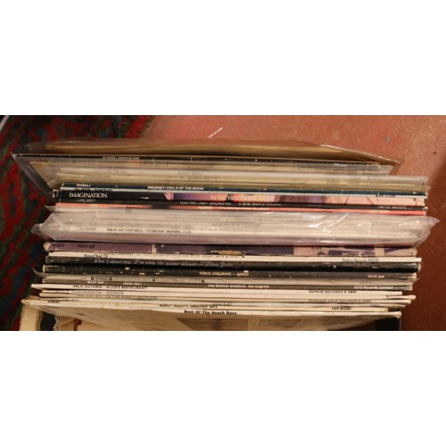 199 - Four boxes of LP vinyl records. To include Elton John, Eric Clapton, Bob Dylan, Status Quo, The Kink... 