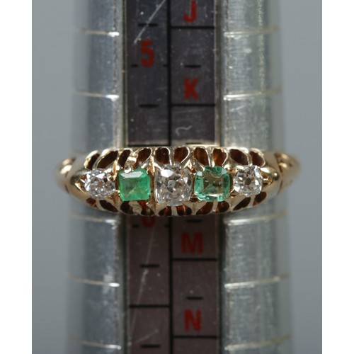 355 - An 18ct gold diamond and emerald five stone ring. Size L. 2.92g.