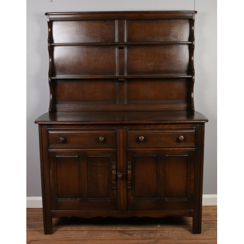 530 - An Ercol Old Colonial dresser.