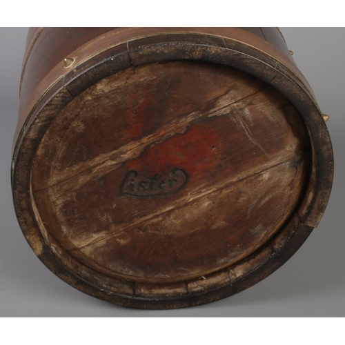 520 - A brass bound mahogany barrel by R.A Lister & Co Ltd. Height 27cm, Diameter 31cm.