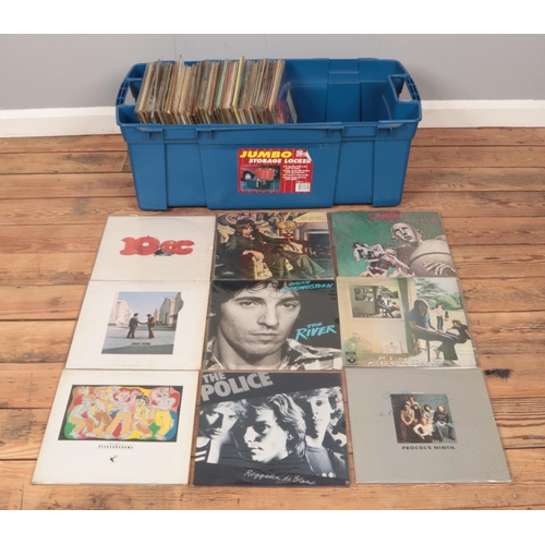 180 - A large storage box containing a good collection of rock and pop vinyl records. To include The Polic... 