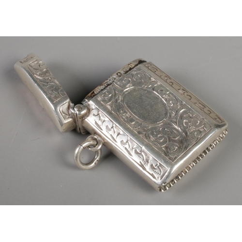 397 - A small silver vesta case with scrolled decoration. Assayed for Birmingham, 1910 by Constantine & Fl... 