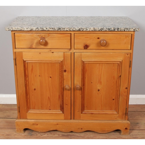 536 - A pine sideboard with marble top.