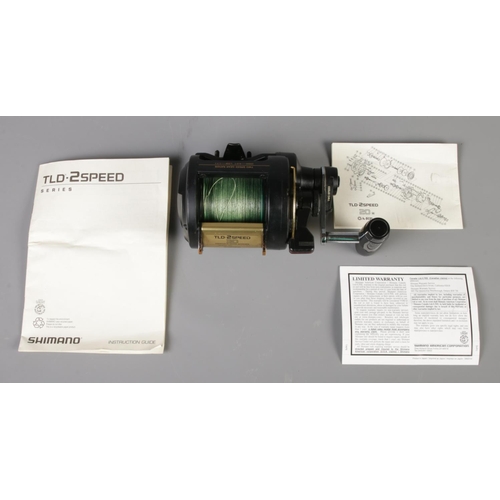 96 - A Shimano TLD 30 2 Speed fishing reel, complete with instruction leaflet and box.