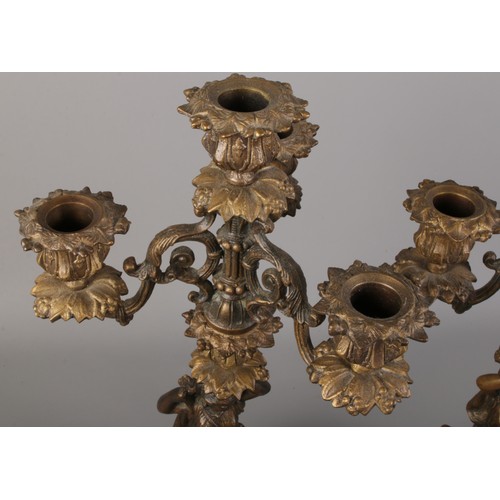 93 - A pair of Souchal bronze three branch candelabras. Decorated with women and foliage.  Stamped Soucha... 