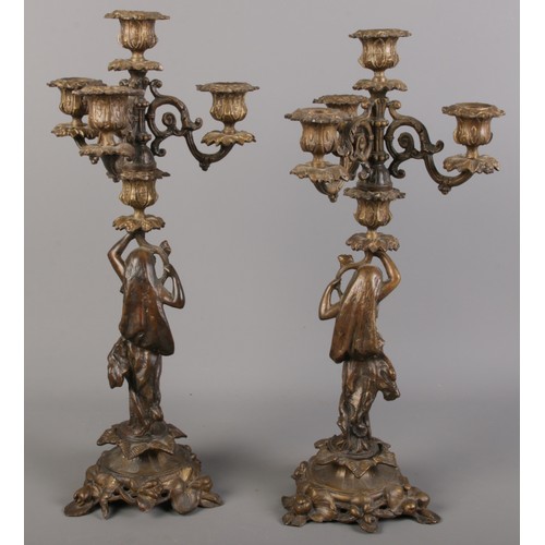 93 - A pair of Souchal bronze three branch candelabras. Decorated with women and foliage.  Stamped Soucha... 