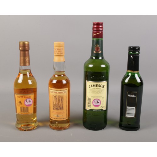 80 - Four bottles of assorted whisky, to include Glenmorangie and Glenfiddich.