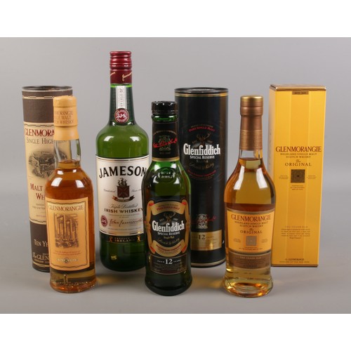 80 - Four bottles of assorted whisky, to include Glenmorangie and Glenfiddich.