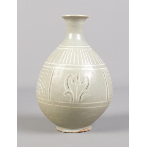 106 - A Korean celadon vase in wooden box. Vase 16cm.