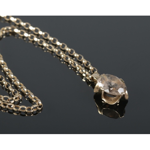 109 - A 9ct gold pendant set with a single faceted clear stone on 9ct gold rolo link chain. Chain length a... 