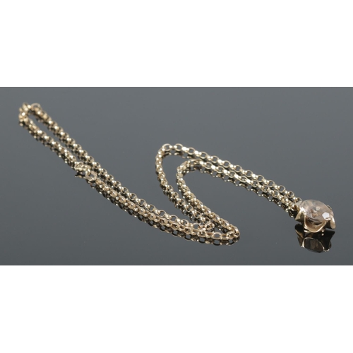 109 - A 9ct gold pendant set with a single faceted clear stone on 9ct gold rolo link chain. Chain length a... 