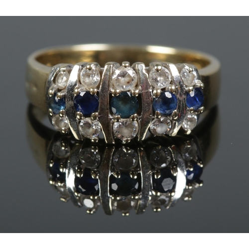 111 - A 9ct gold sapphire and colourless stone ring. Size Q. 4.17g.