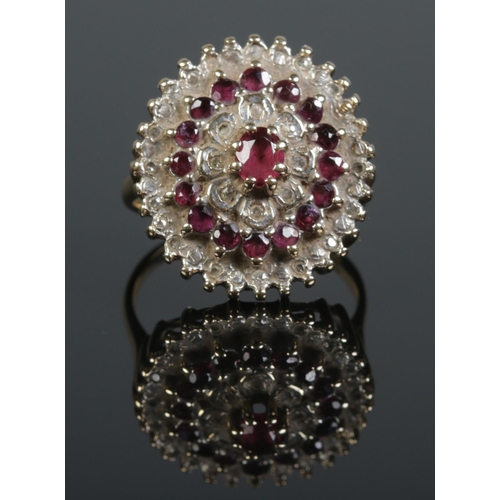 114 - A vintage 9ct gold ruby and diamond cluster ring. Assayed for Birmingham 1979. Size O. 6.34g.