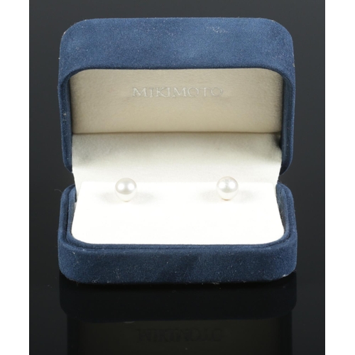 120 - A boxed pair of Mikimoto 18ct gold and pearl earrings. Diameter of pearl 6mm.