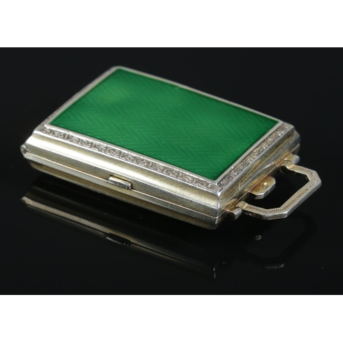 124 - A small silver and enamel compact with gilt interior. Bearing import marks for London 1926 and maker... 