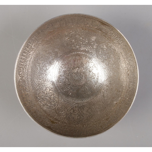 32 - An Eastern silver bowl with etched decoration. 12cm diameter. 130g.