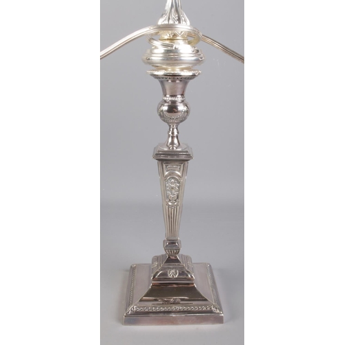 44 - A large pair of silver plated candelabra with detachable nozzles. Height 54cm.