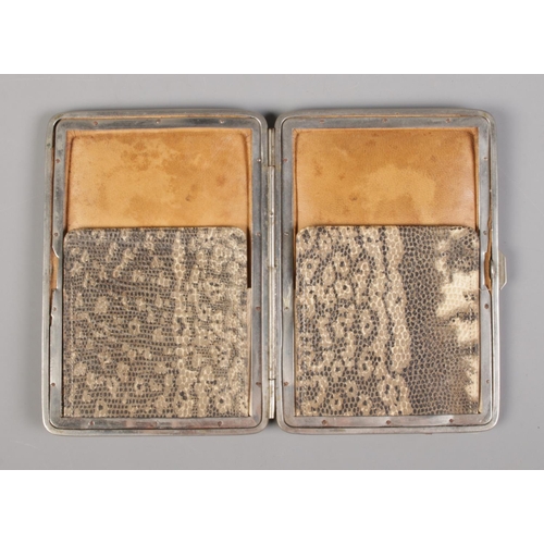 60 - An early 20th century snake skin wallet.