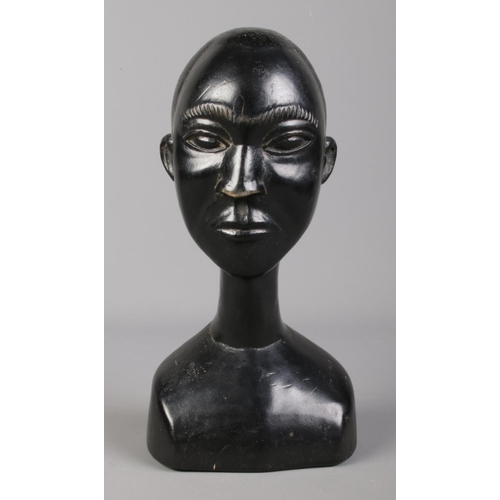 68 - An African tribal carved ebony bust of a man. Label to base attributing the work to Osei Bonsu, Asha... 