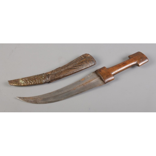 71 - A Kindjahl type knife in scabbard. 23cm curved blade.