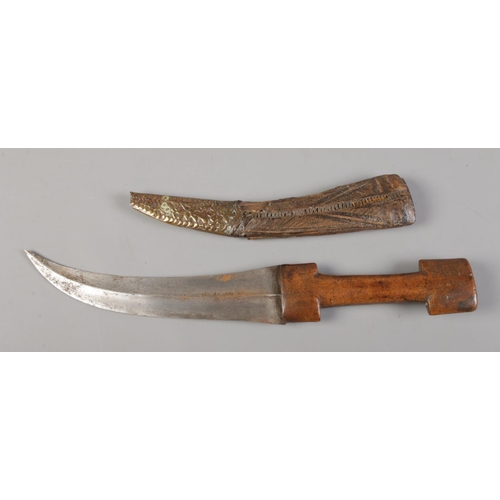 71 - A Kindjahl type knife in scabbard. 23cm curved blade.