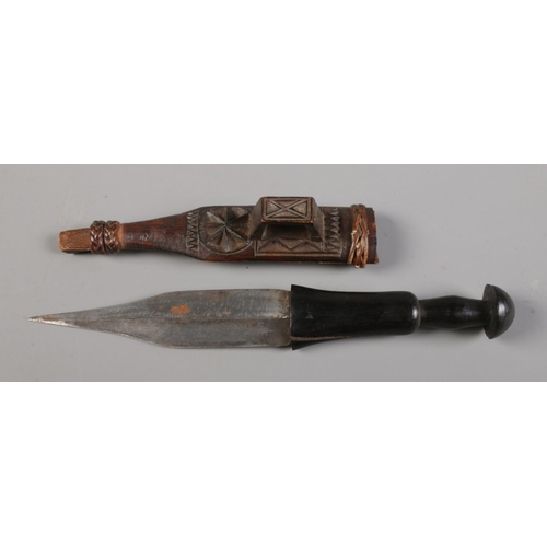 72 - An African tribal double edge dagger in scabbard, possibly Catawiki tribe, along with a similar smal... 