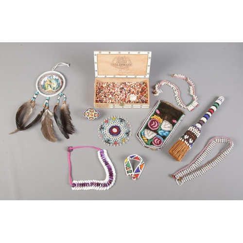 73 - A collection of mainly African beadwork items. Includes a quantity of loose stone beads, jewellery e... 