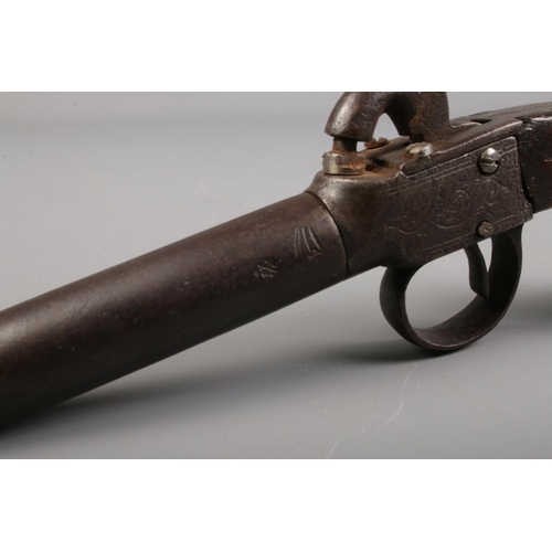 74 - A 19th century percussion cap pistol with screw off barrel and walnut grip.