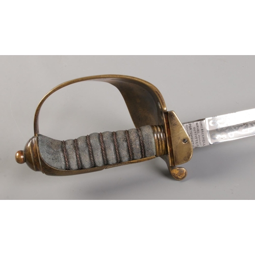 76 - A Royal Naval Officers sword in leather and brass scabbard belonging to Captain Samuel Charles Taylo... 