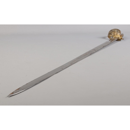 76 - A Royal Naval Officers sword in leather and brass scabbard belonging to Captain Samuel Charles Taylo... 