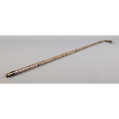 81 - An early 20th century walking cane with silver collar and tip. Assayed London 1913.