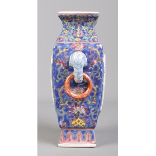 87 - A Chinese twin handled vase decorated in coloured enamels with panels depicting children at play. Be... 