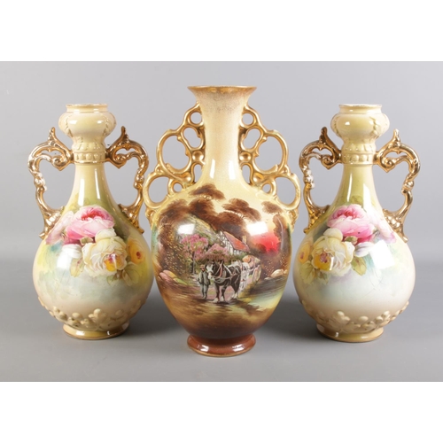 307 - Three large floral vases. To include a H Lear painted example. Tallest: H: 42cm.