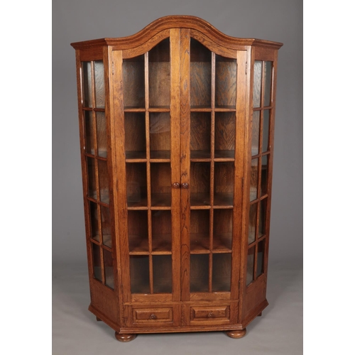 646 - A large oak display cabinet with glass panel doors and two drawer base. (198cm x 130cm)