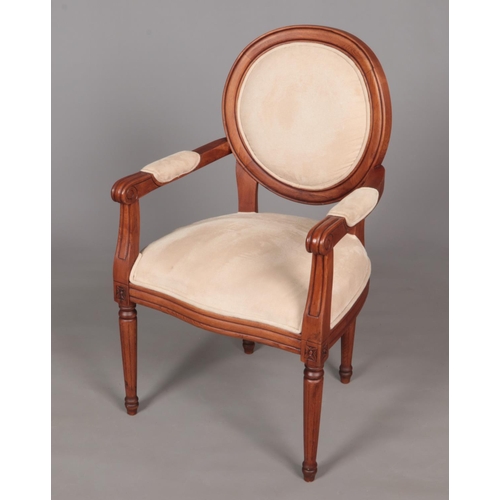 647 - A French armchair with cream upholstery.