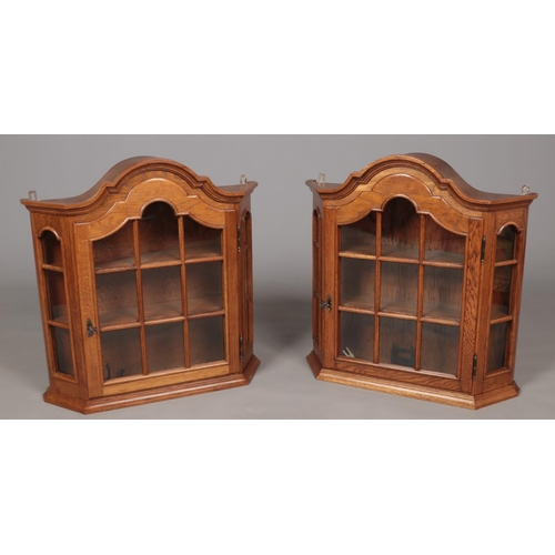 648 - A pair of oak wall cabinets with glass panel doors and sides.