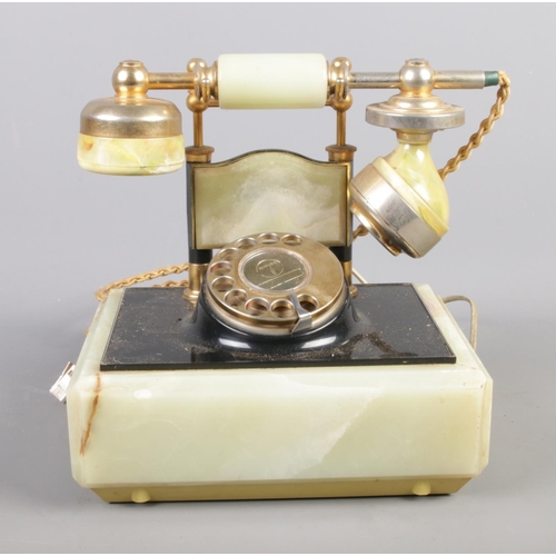 102 - A vintage onyx telephone.