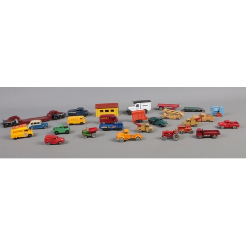 107 - A collection of Dinky & Lesney die cast vehicles. To include Dinky Toys - Austin Taxi, Royal Mail Va... 