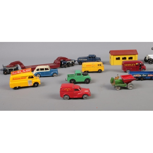 107 - A collection of Dinky & Lesney die cast vehicles. To include Dinky Toys - Austin Taxi, Royal Mail Va... 