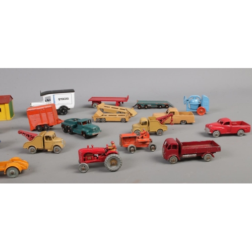 107 - A collection of Dinky & Lesney die cast vehicles. To include Dinky Toys - Austin Taxi, Royal Mail Va... 