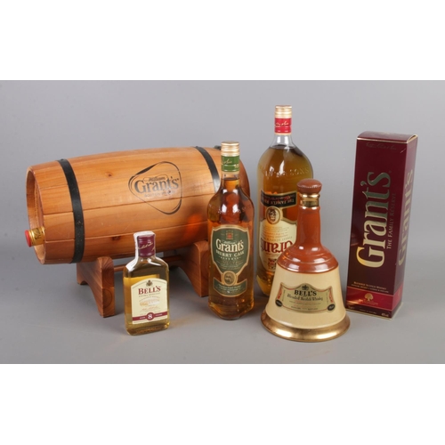 108 - A collection of Grant's & Bell's Scotch whisky. To include Grant's 1.5 litre 'the family reserve' wi... 