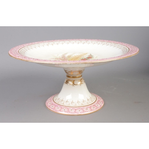 123 - A Royal Worcester hand painted dessert service. To include two comports and seven plates. Design dep... 