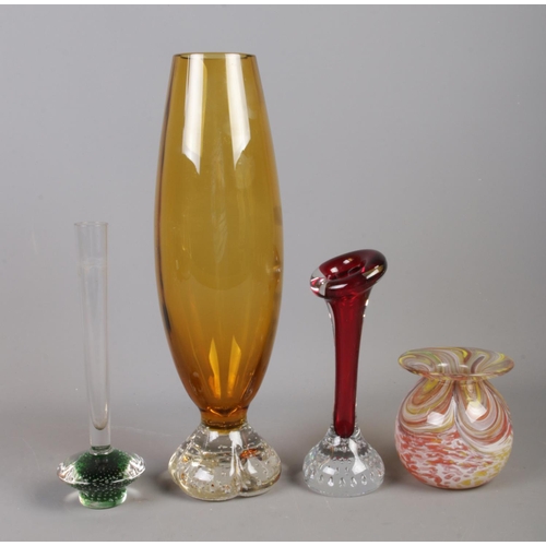 128 - An assortment of coloured and controlled bubble glass. To include cranberry coloured glasses, and as... 