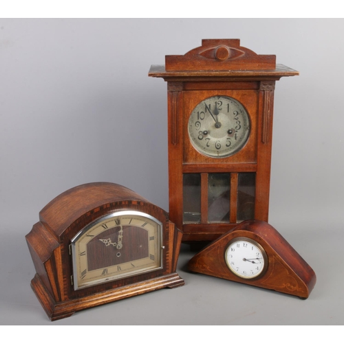 251 - Three clocks. Including small mantel clock with inlaid decoration, etc.