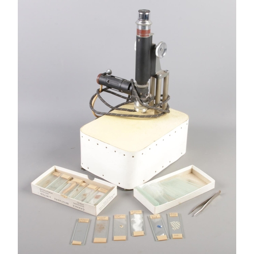 52 - A Beck electric microscope along with a quantity of histology and similar slides.