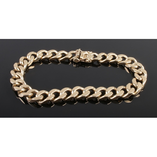 495 - A 9ct gold flat link bracelet. 35.09g.