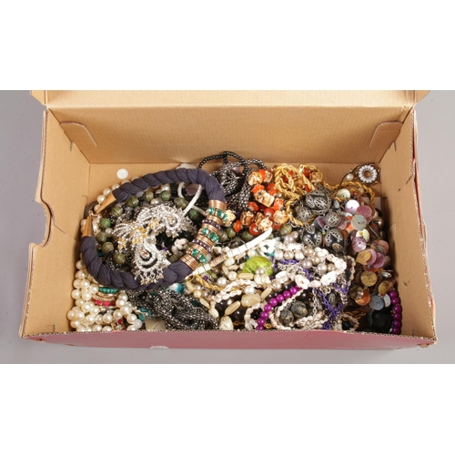 74 - A box of beaded necklaces.